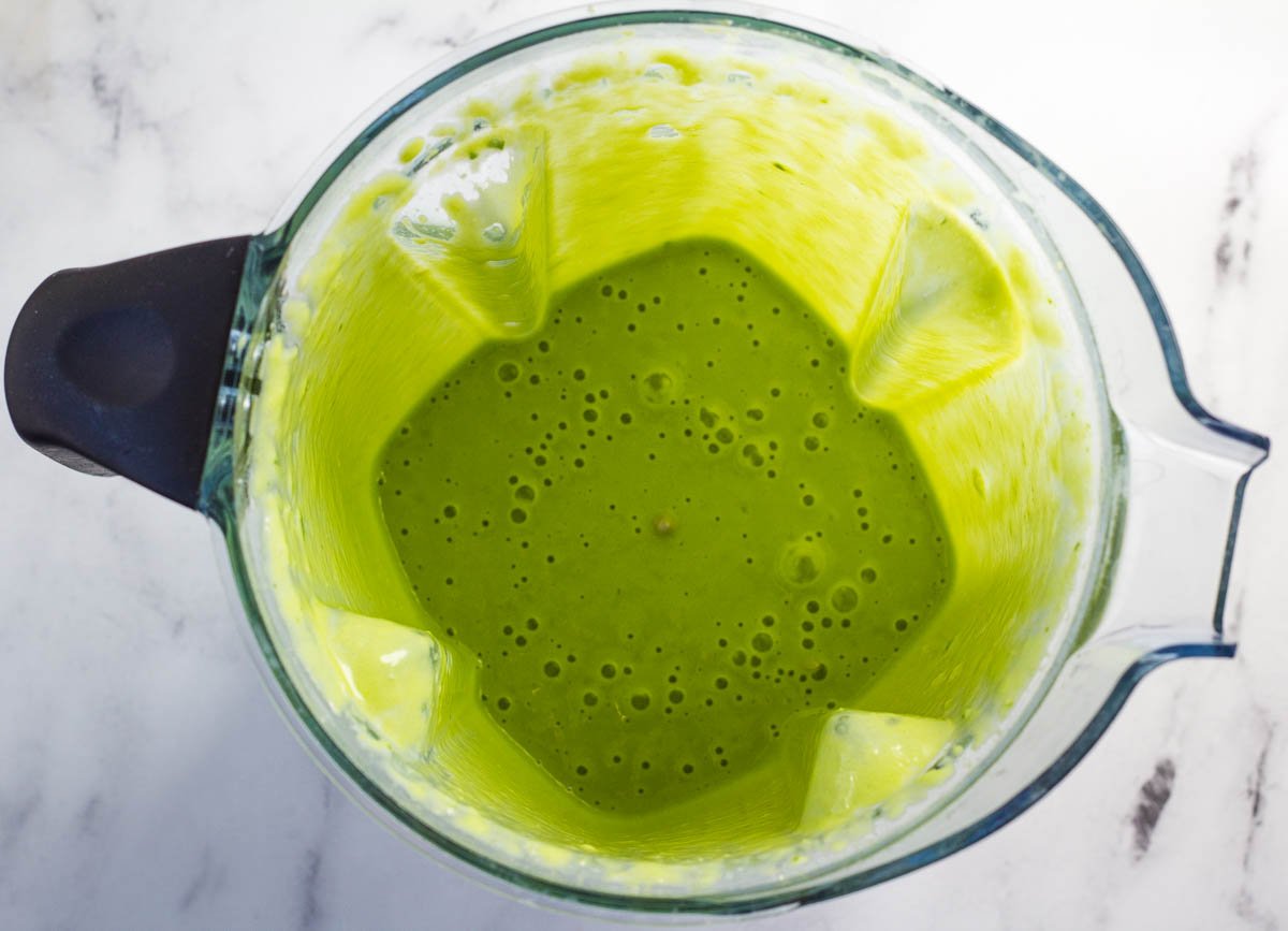 Blended green shake in blender.
