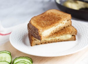 vegan grilled cheese sandwich on white plate