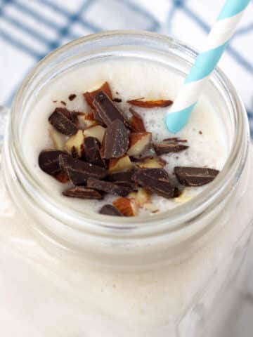 coconut milkshake topped with chocolate and almonds