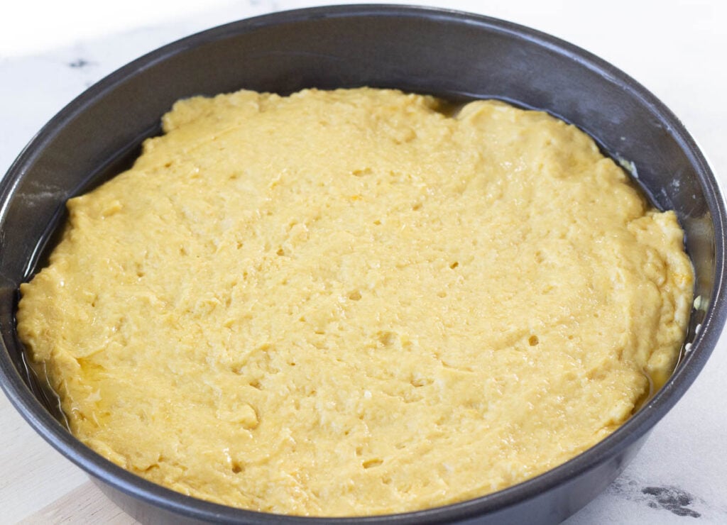 yellow cake batter in pan