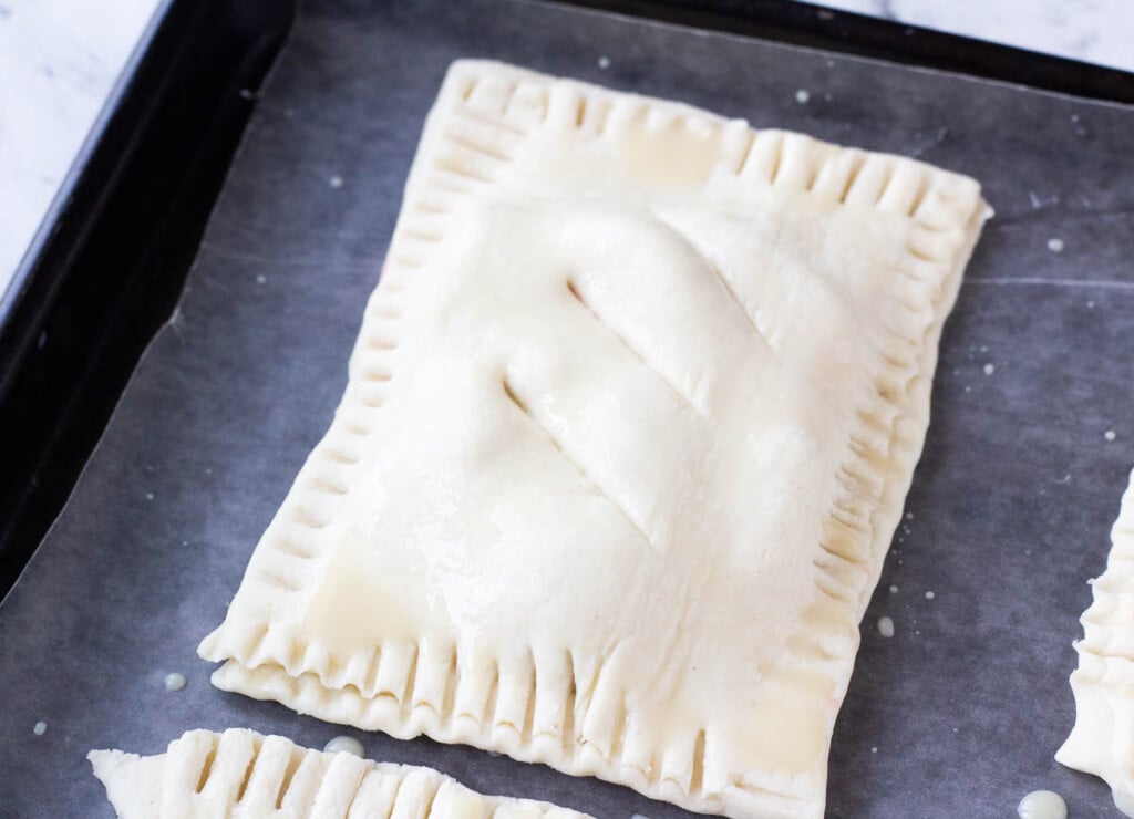 vegan hand pie before it's baked with three slits cut on top