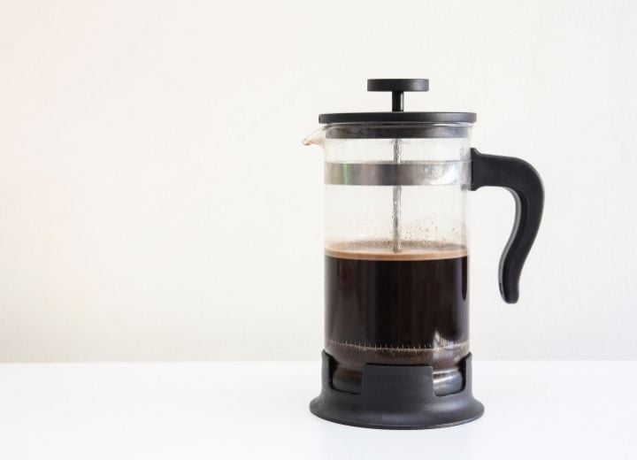 French Press Coffee maker filled with black coffee