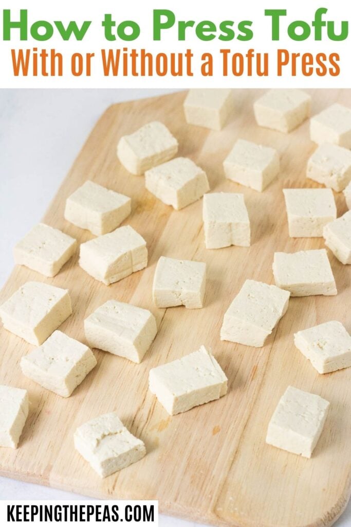 block of tofu in white and green tofu press
