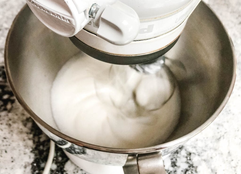 stand mixer beating aquafaba that's doubled in size