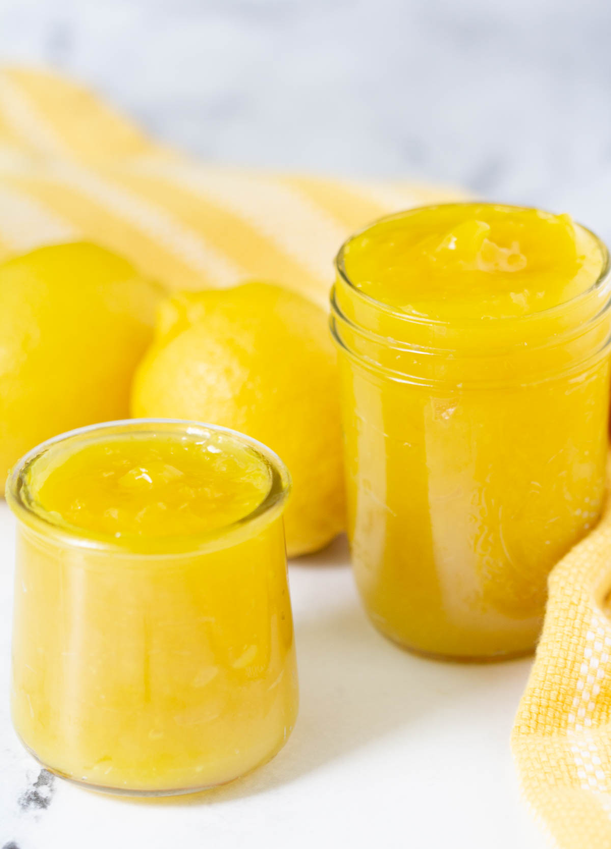 Lemon curd in glass jars.