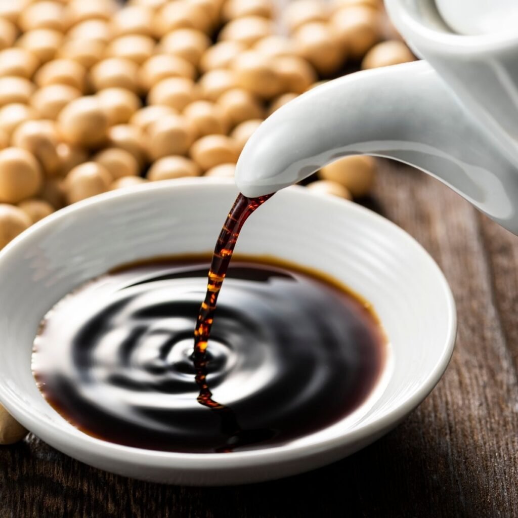 soy sauce poured into small white bowl