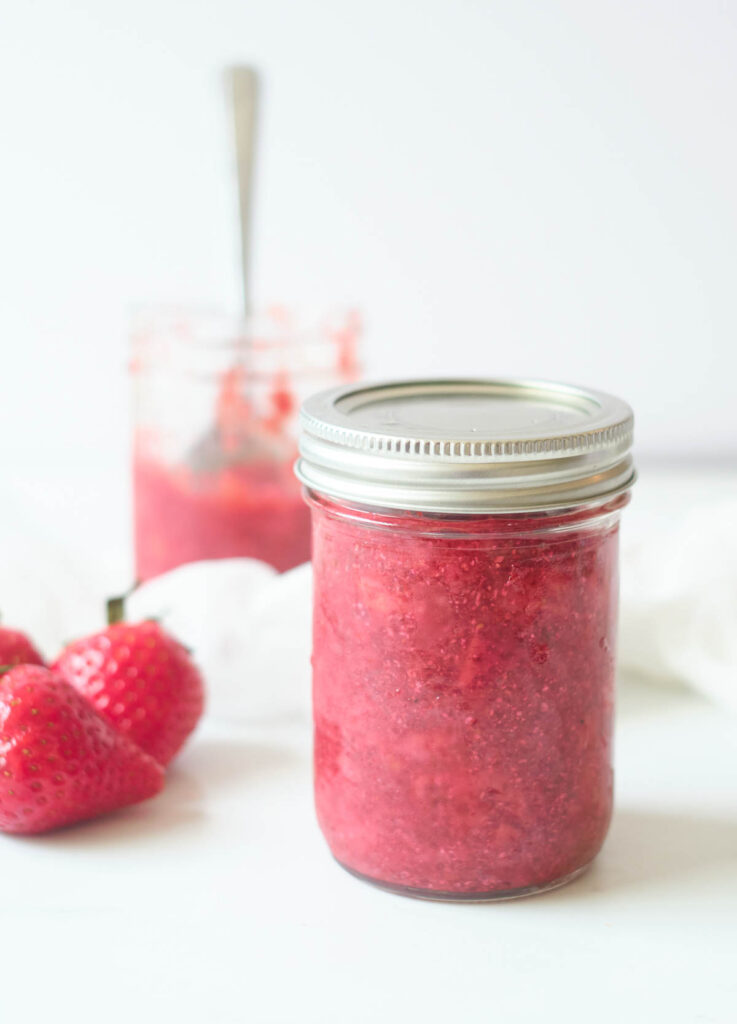 Low sugar strawberry jam jarred.