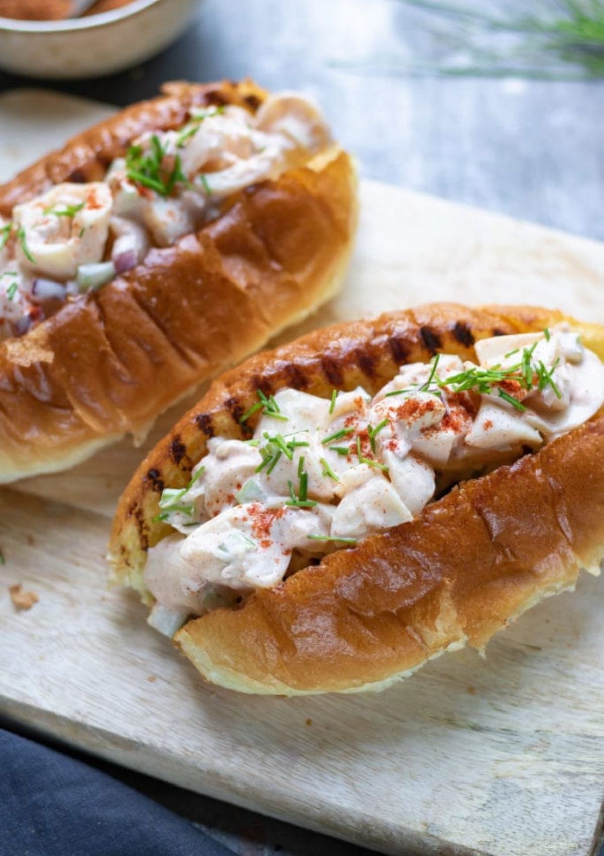 vegan lobster rolls  on wood serving trays