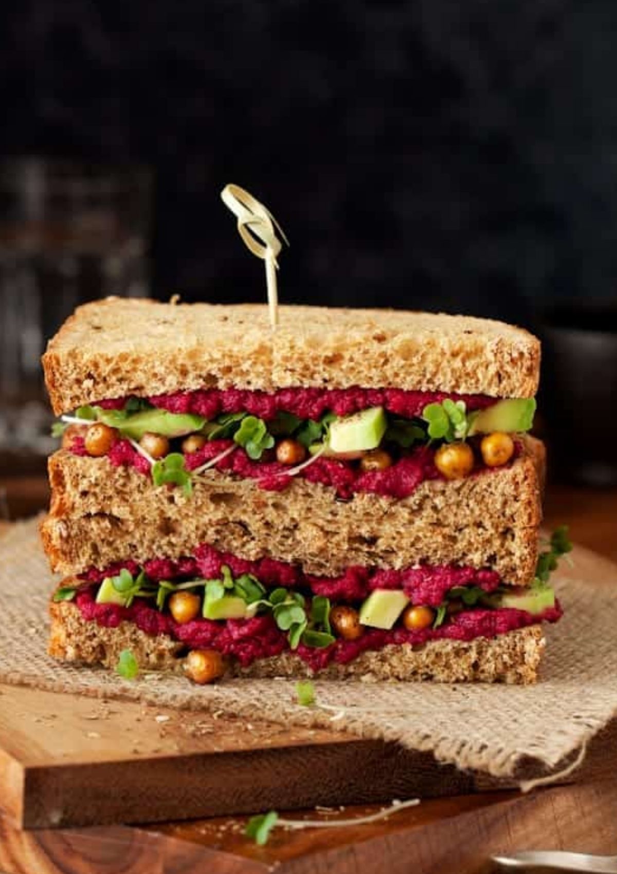beet and chickpea sandwich with sliced avocado