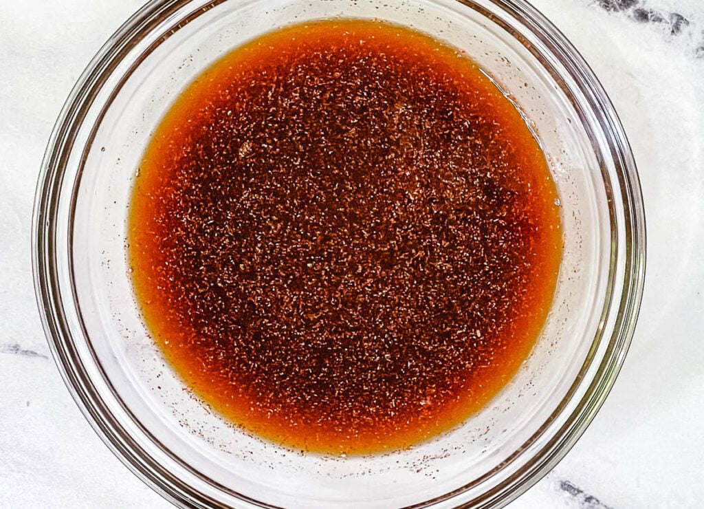 Smoky soy sauce marinade in glass bowl.