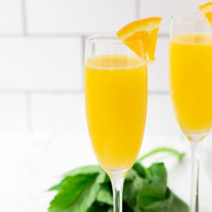 mimosa mocktail with wedge of orange