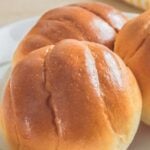 Browned rolls on plate.