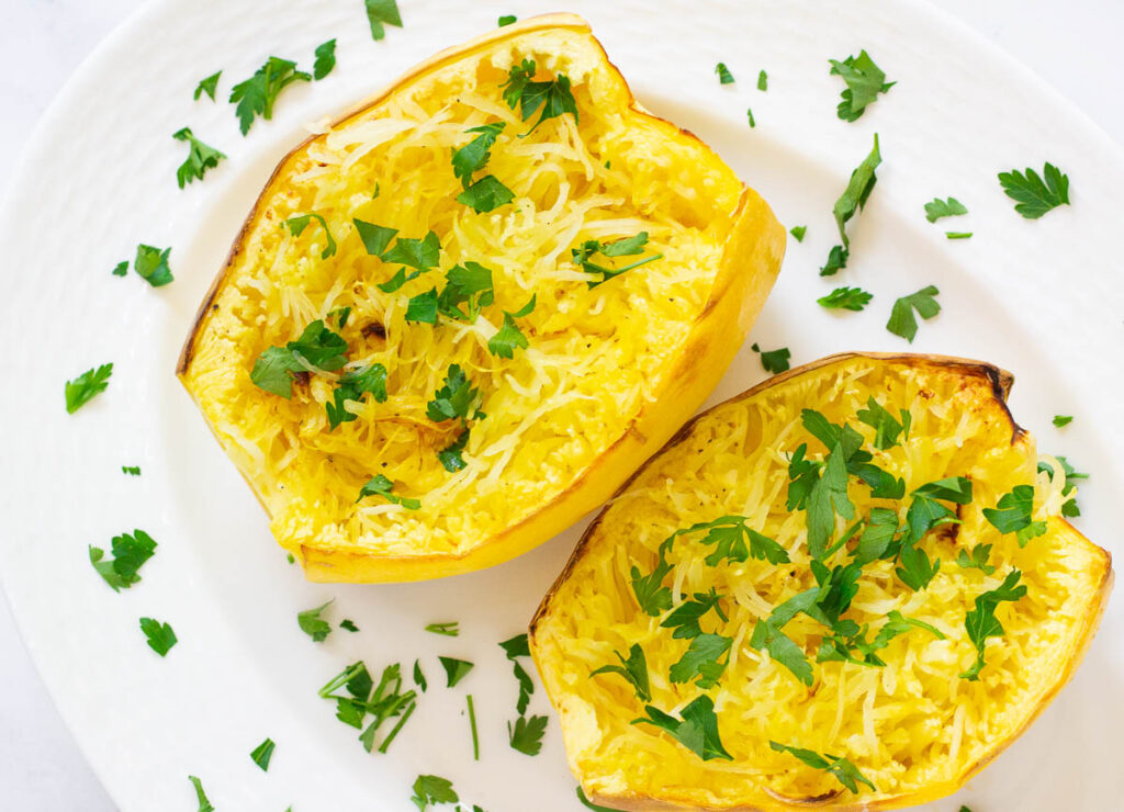 Air fryer spaghetti squash topped with chopped parsley.