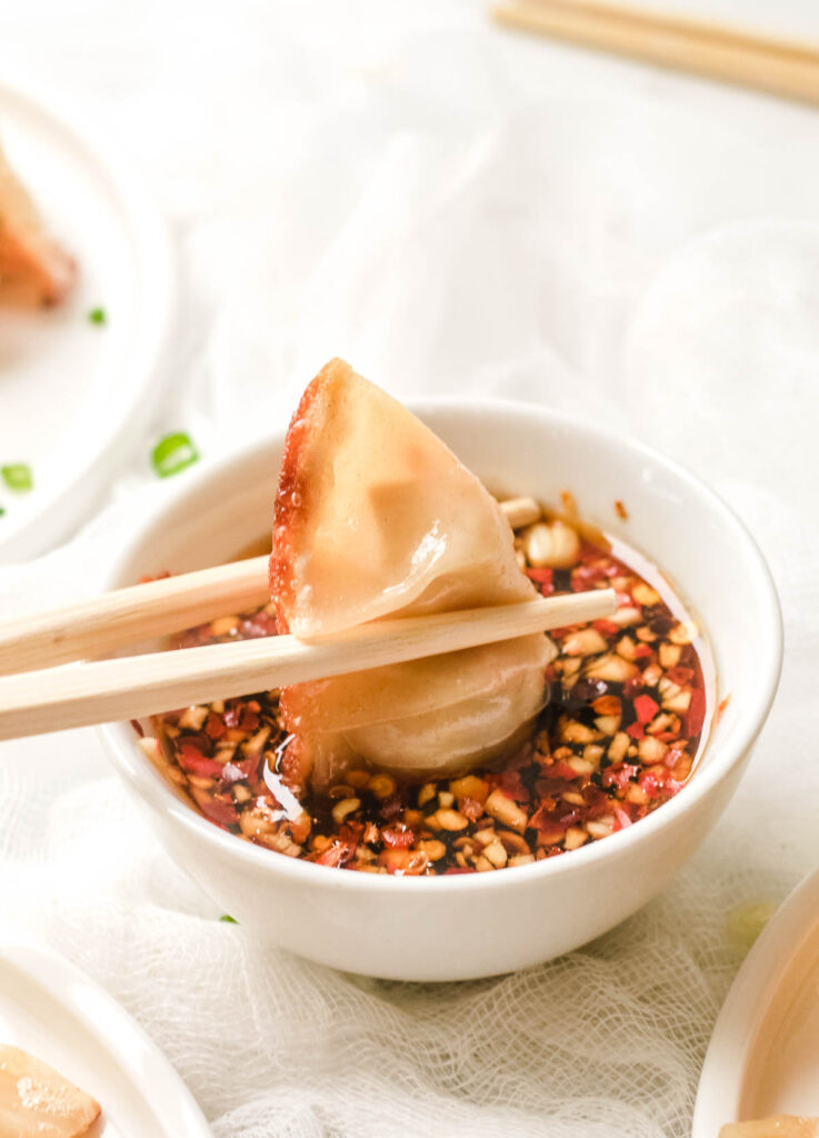 Dumpling dipped in spicy soy sauce.