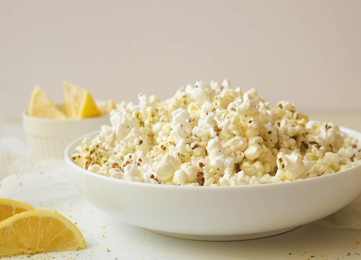 Popcorn in shallow white bowl.