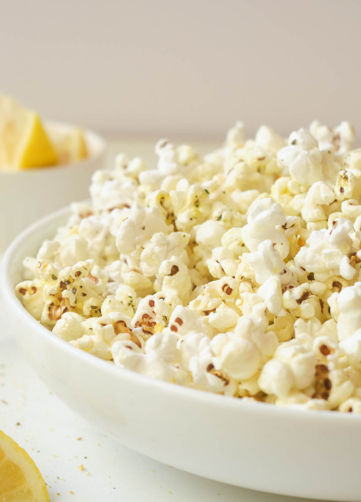 Popcorn in white shallow white bowl. 