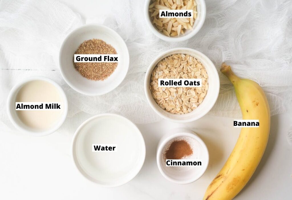Ingredients for Banana Porridge: rolled oats, banana, cinnamon, water, almond milk, ground flax, and slivered almonds.