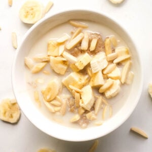 Banana porridge in white bowl.