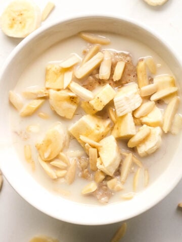 Banana porridge in white bowl.