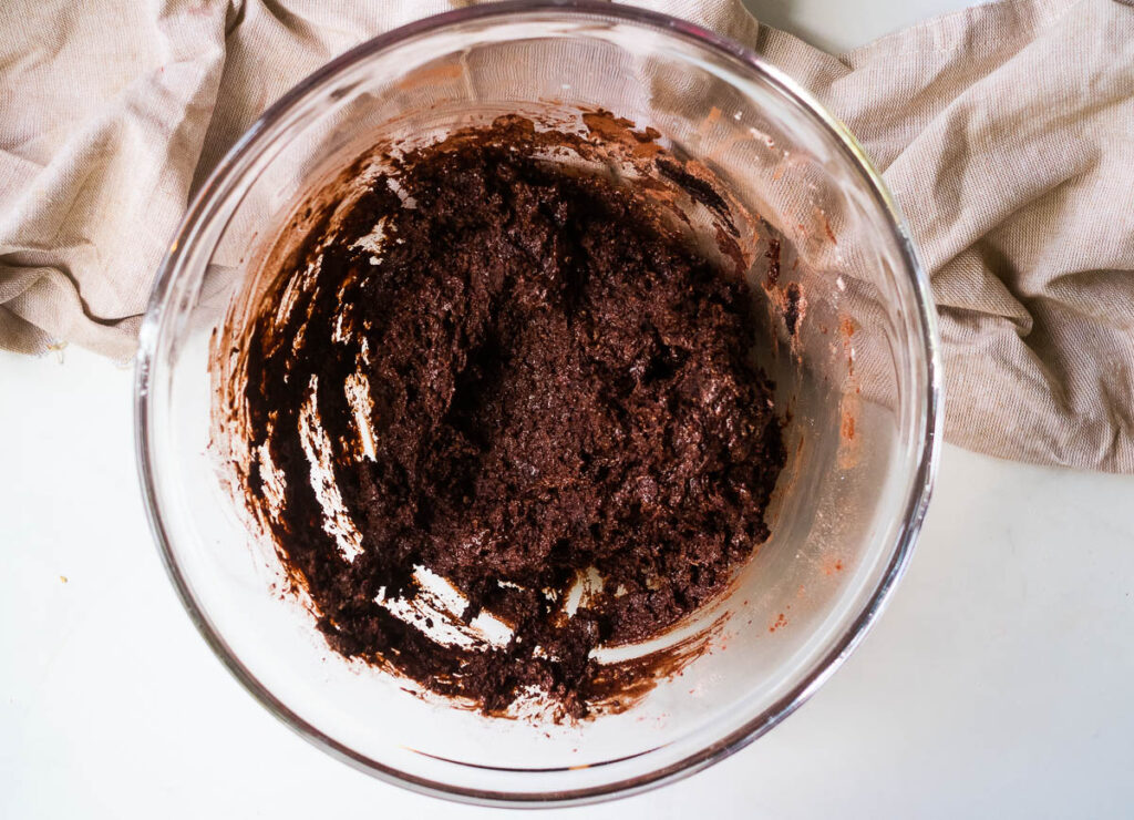 Brownie batter in glass bowl.