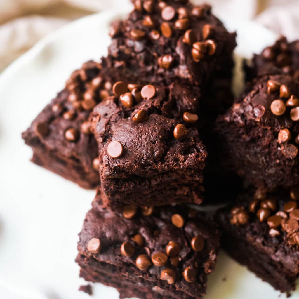 Dairy free brownies on white plate.