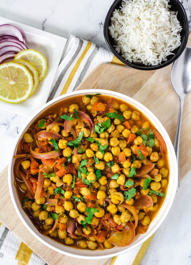 Punjabi Chole recipe in wide white bowl topped with cilantro.