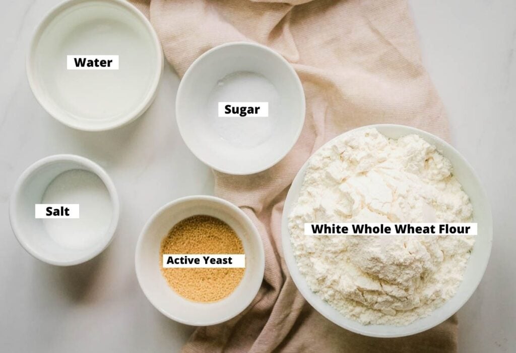 Vegan Bagel Recipe Ingredients: White whole wheat flour, active yeast, salt, water, sugar.