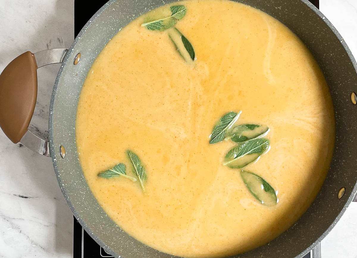 Coconut milk, stock, and sage in large pot.
