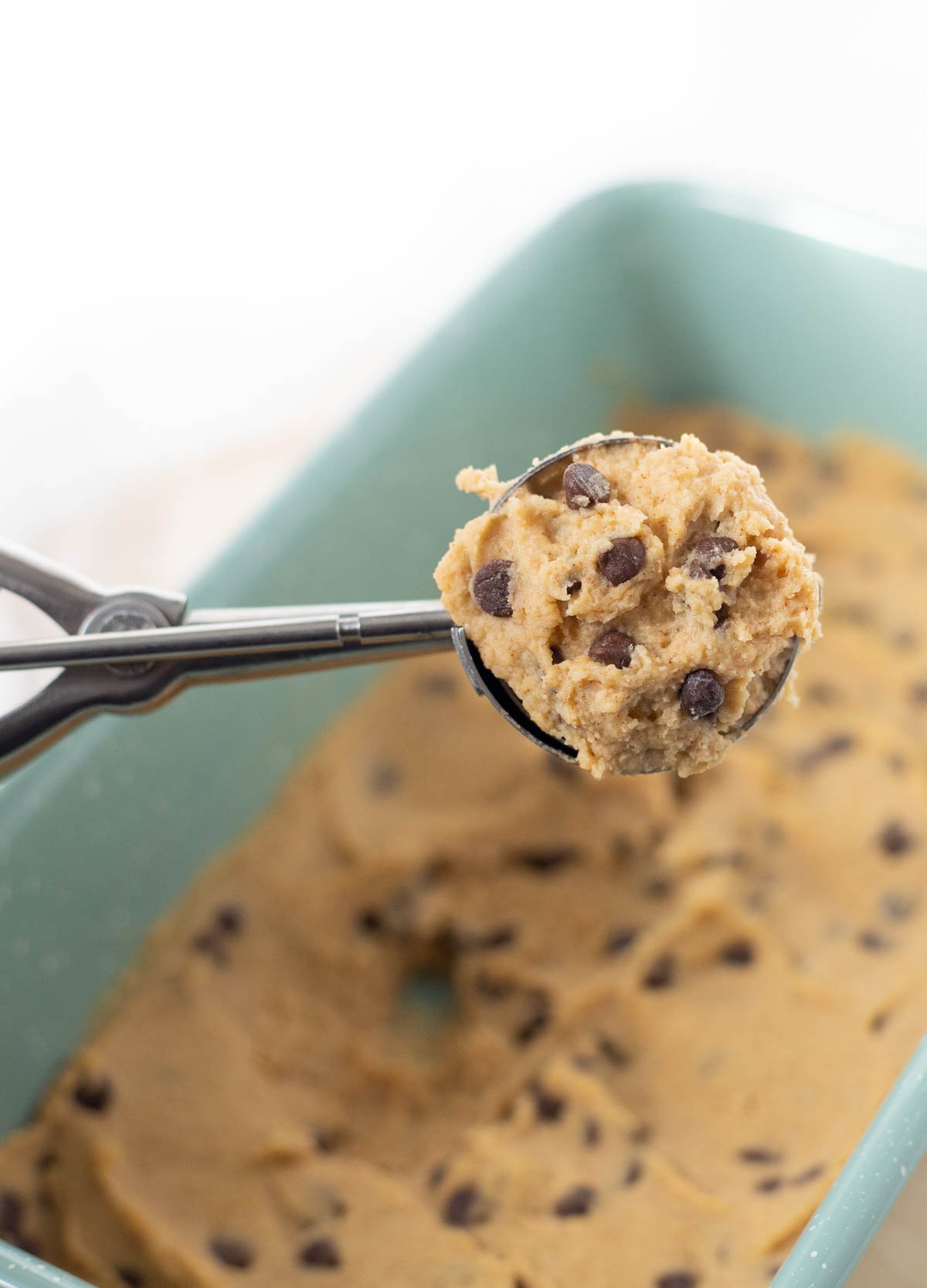 Chickpea cookie dough on cookie scoop. 