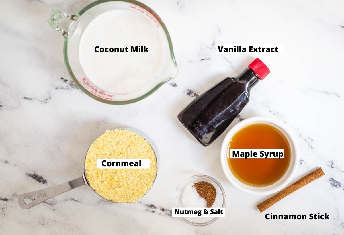 Coconut milk, vanilla extract, maple syrup, cinnamon stick, nutmeg, salt, and cornmeal.