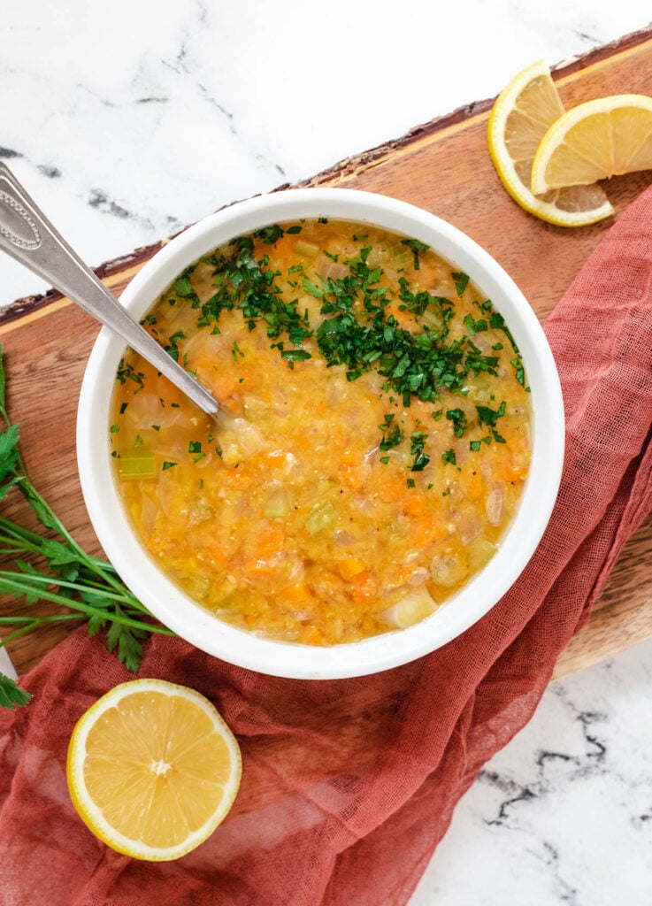 Lebanese lentil soup with chopped parsley.
