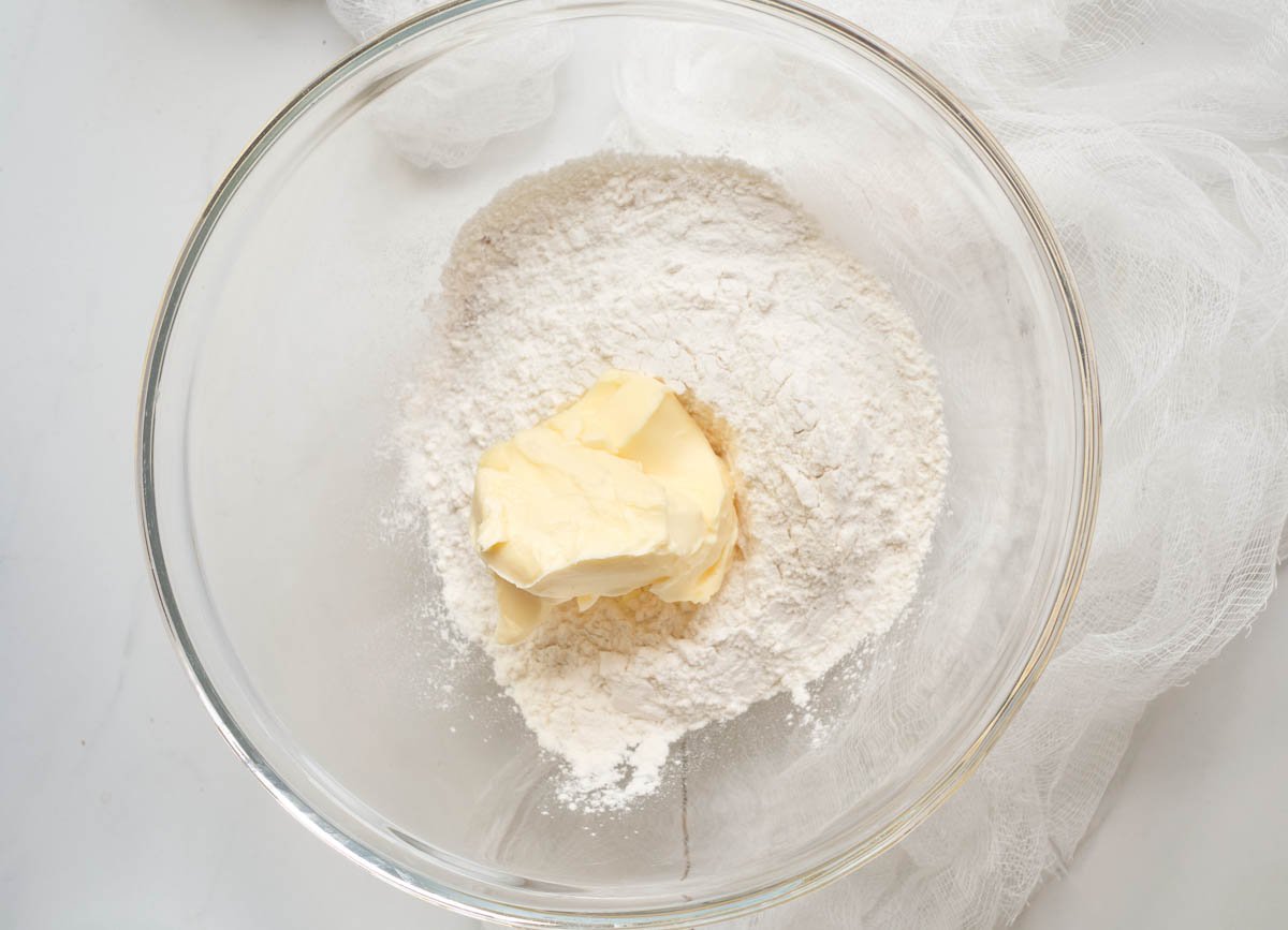 Flour and butter in mixing bowl. 