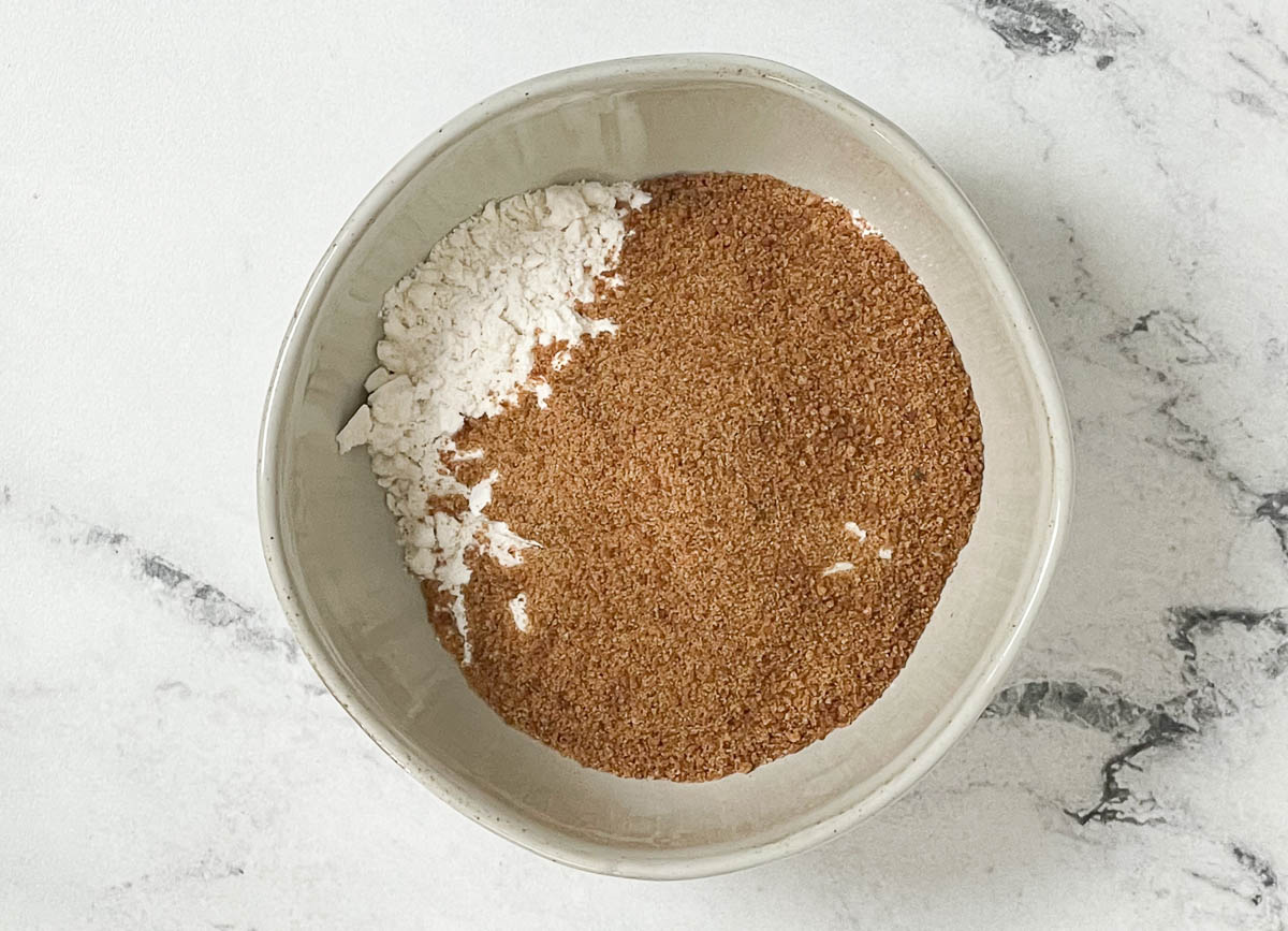 Flour, sugar, baking powder, and salt in bowl. 