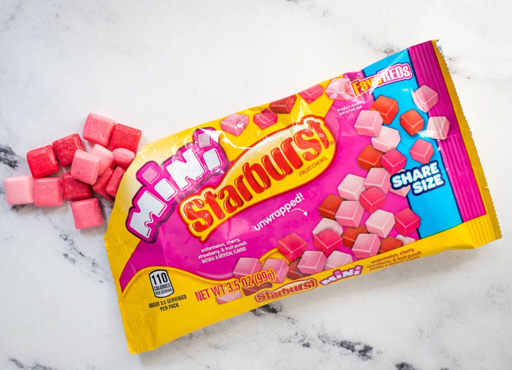 Bag of Starburst Minis with some of the candies coming out.