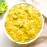 Vegan broccoli cheddar soup in white bowl.