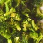 Air fried frozen broccoli florets on plate.