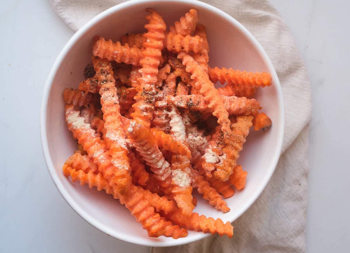 Frozen sweet potato fries tossed with garlic powder, pepper, and olive oil. 