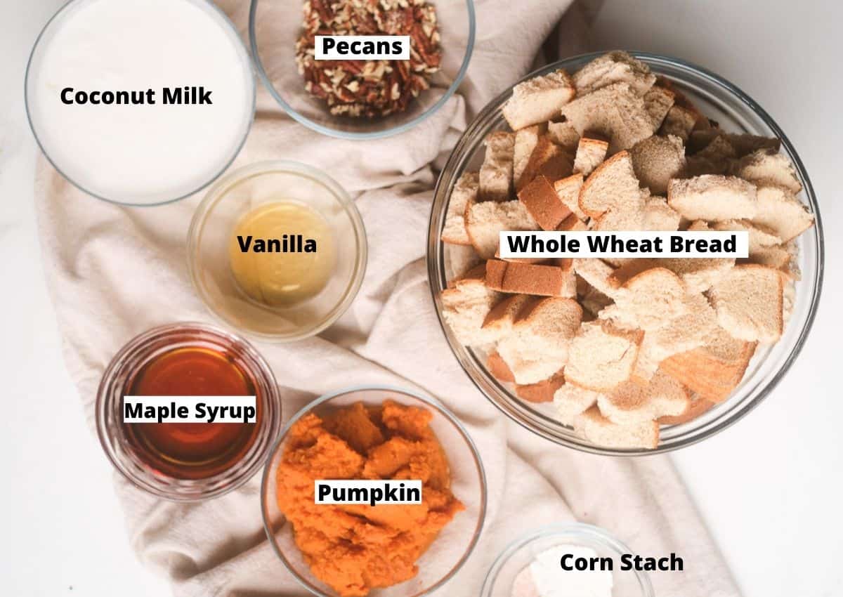Ingredients for vegan French toast casserole: coconut milk, pecans, whole wheat bread, vanilla, maple syrup, pumpkin, corn starch.
