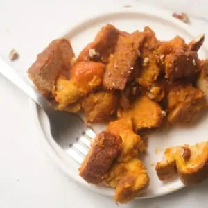 Vegan French toast casserole serving on white plate.