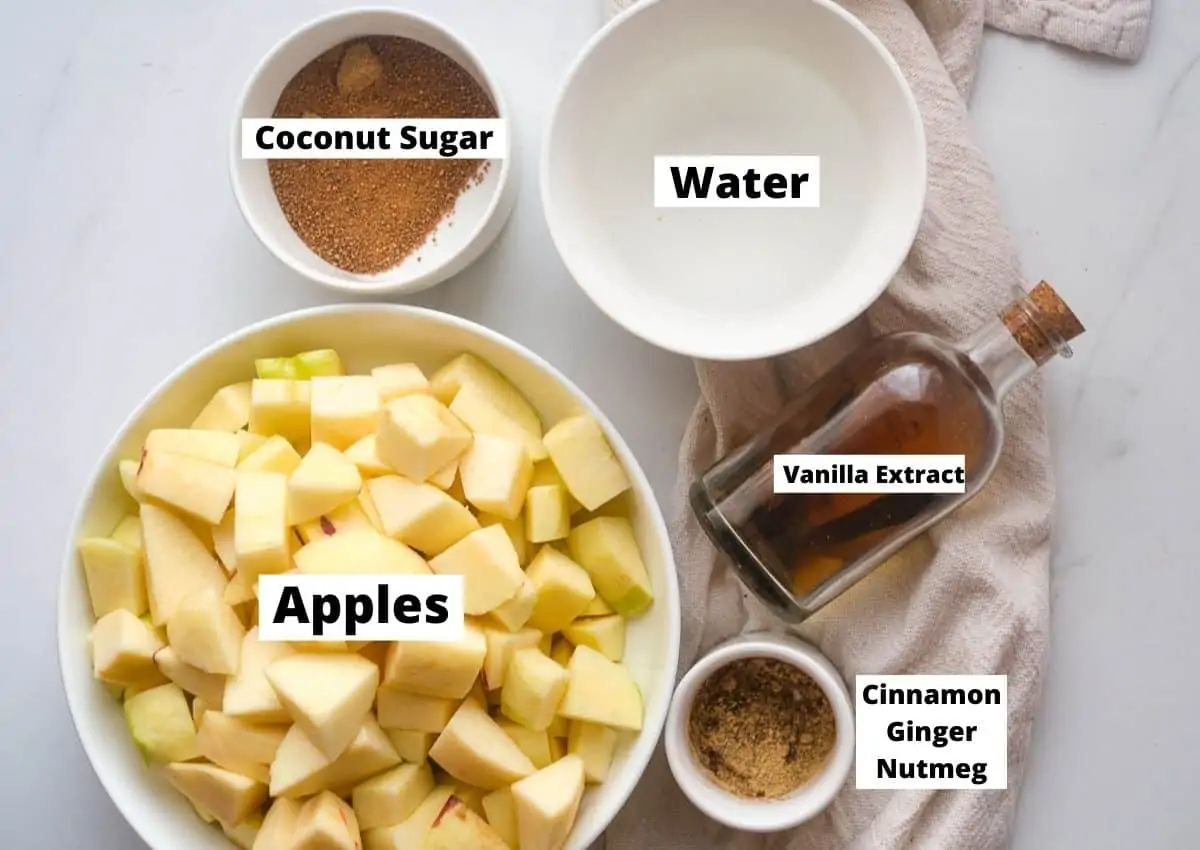 Apple butter ingredients: diced apples, coconut sugar, water, vanilla extract, and warm spices. 
