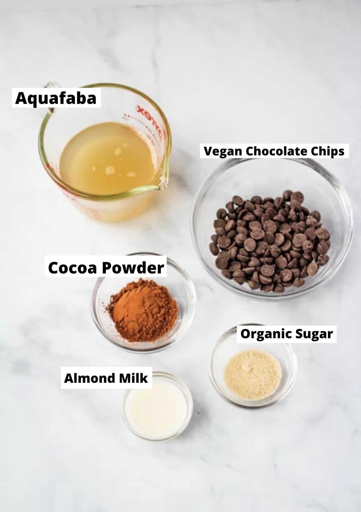 Aquafaba mousse ingredients: aquafaba, chocolate chips, sugar, almond milk, cocoa powder.