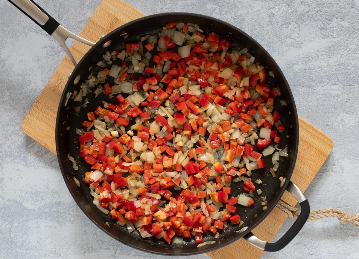 Onions, garlic, and red pepper in sauté pan. 