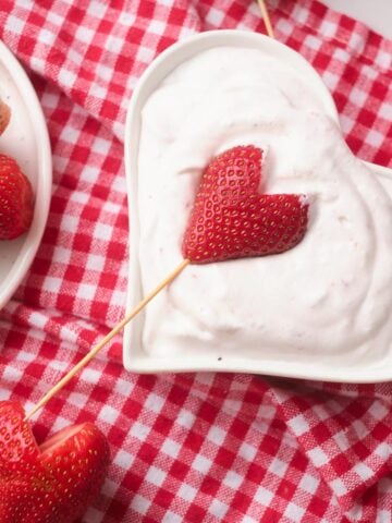 Strawberry hearts dipped in creamy yogurt.