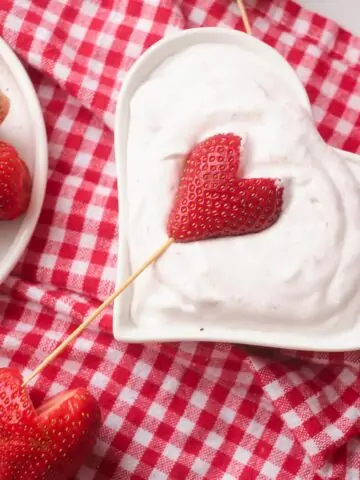 Strawberry hearts dipped in creamy yogurt.