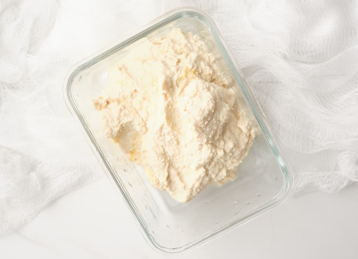 Blended tofu and seasoning in a glass  rectangular container.