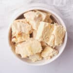 Vegan feta cheese cubes in white bowl.