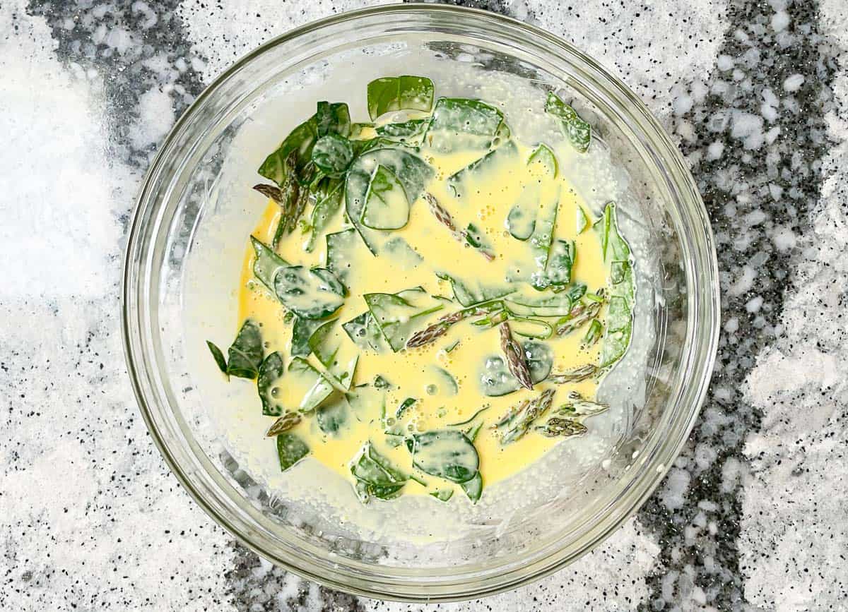 Just Egg mixture with chopped spinach and asparagus spears. 