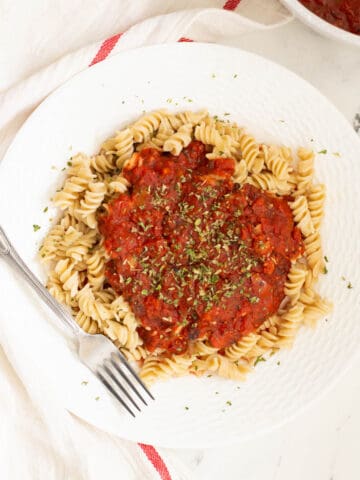 Hearty marinara sauce topped in pasta.
