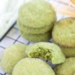 Matcha cookies stacked on top of one another.