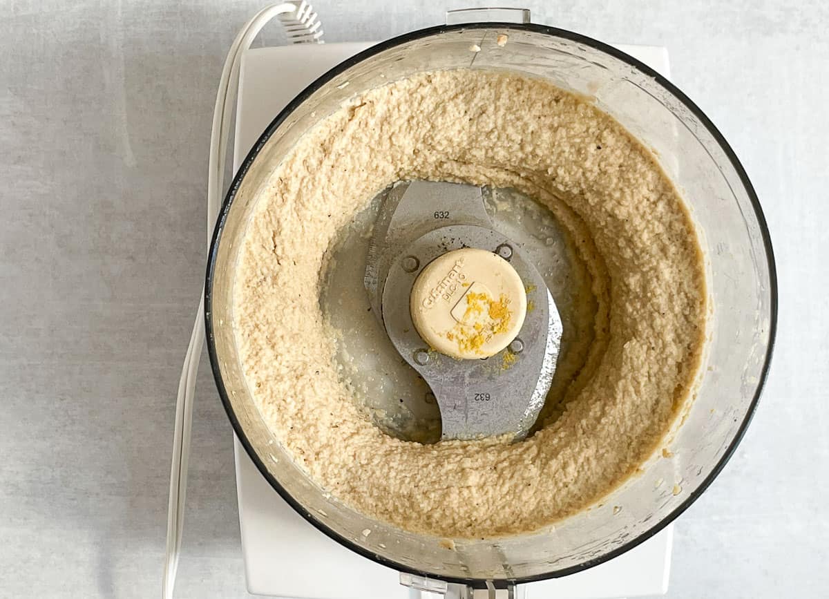 Blended cashew ricotta in food processor. 